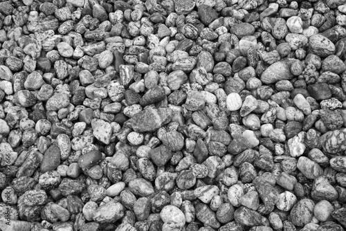 Black and white image of pebbles on the beach