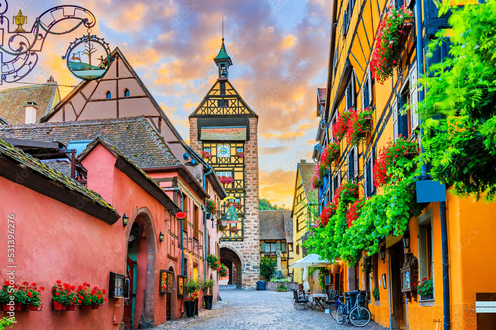 Riquewihr, France. Picturesque street with traditional half timbered houses on the Alsace Wine Route.