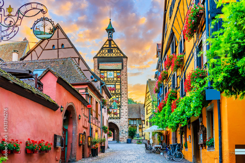 Riquewihr  France. Picturesque street with traditional half timbered houses on the Alsace Wine Route.