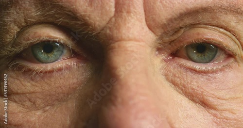 Senior man, eyes and deterioration of health and eyesight of elderly man with wrinkles. Nostalgic elderly male with dementia, glaucoma or alzheimers feeling forgetful and suffering from memory loss photo