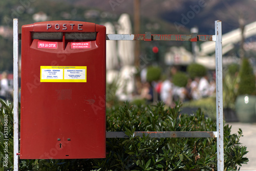 Italian post office red mailbox in Como. Traslation: For the city, For all other destinations. photo