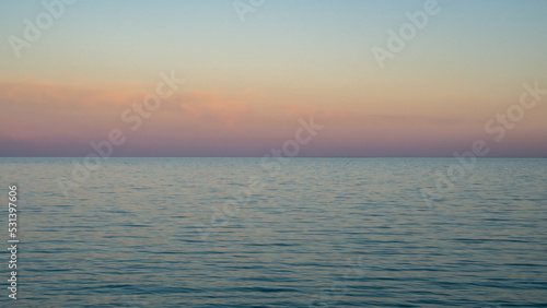 The water surface at sunset. Calm beautiful sea