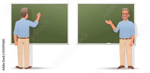 Man teacher writes on the blackboard and points to something. Professor in glasses is giving a lecture