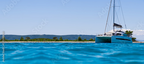 Catamaran sailing in ocean. paradise at sea. Blue sky and turquoise blue sea water. Mexican Caribbean beaches.