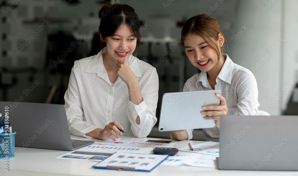 Two Young Asian businesswoman discuss with new startup project Idea presentation, analyze planning and financial Two Young Asian businesswoman discuss with new startup project Idea presentation, analyze planning and financial