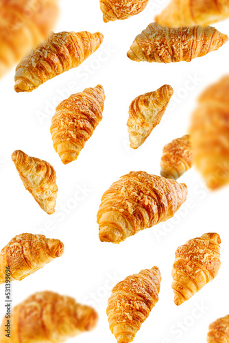 Falling fresh baked croissants with cheese. French pastry concept. Bakery pattern with baked croissant.