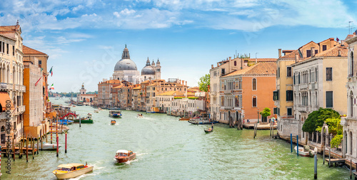 View of Grand Canal and Basilica Santa Maria della Salute in Venice, Italy. Summer holidays. Travel concept background.