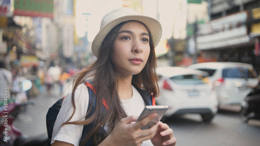 Travel concept of 4k Resolution. Asian woman using phone on the road while traveling.