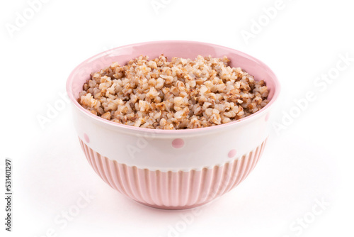 Buckwheat porridge in a pink bowl (plate) on a white isolated background. Porridge for a child (baby). Healthy breakfast, side dish. Template for the design.