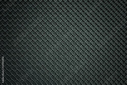 Abstract black metallic mesh texture of the speaker for background.