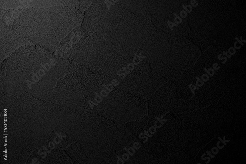 Fotografia Black wall texture, rough background, dark concrete floor plaster wall background with black paint