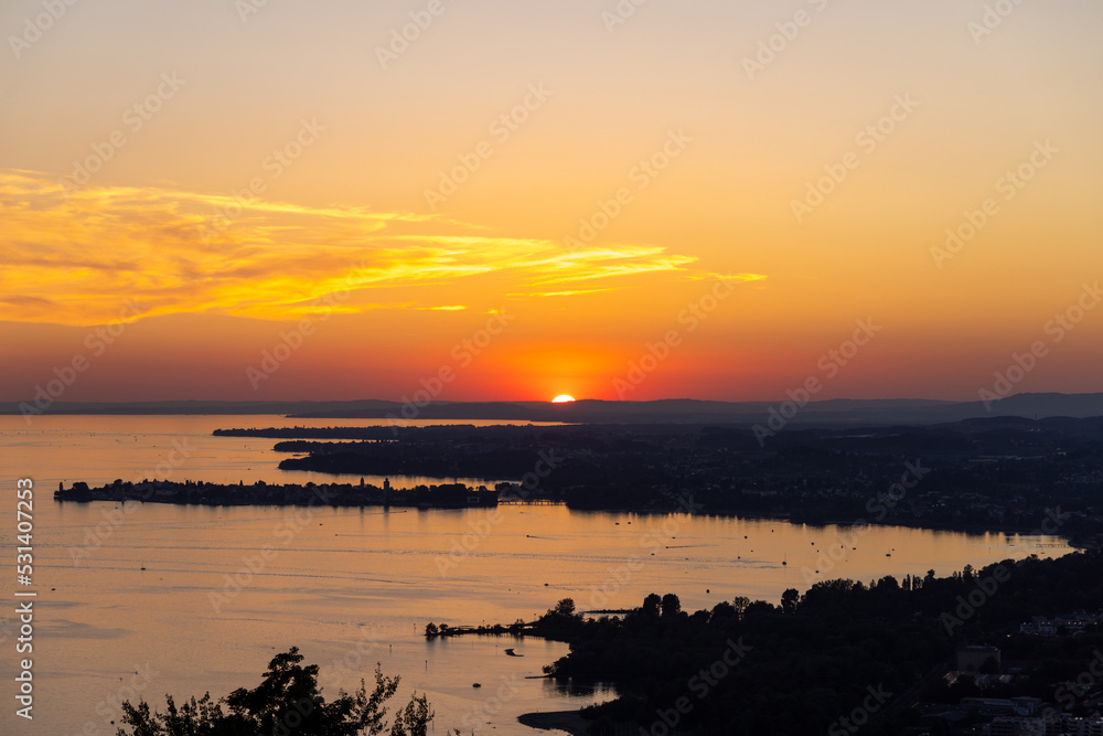 Sunset over the Bodensee lake in Germany, Austria, during summer with the island Lindau in the middle