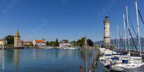 Panoramic view of the Marina of Lindau, Bodensee, Germany, with the lighthouse, the Bavarian Lion and the Mangturm tower in the background