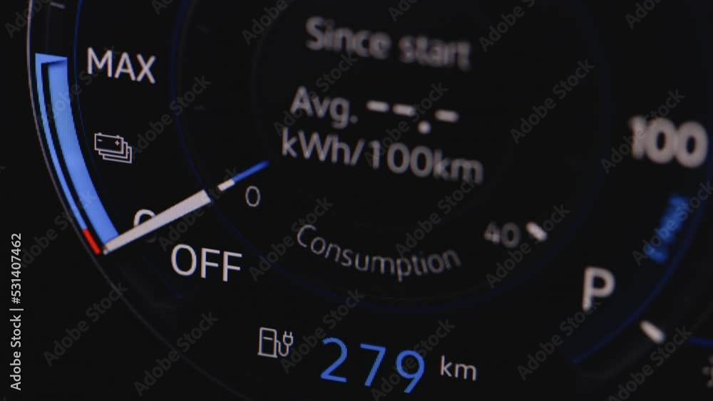 Close up shot of electric car dashboard view during fast charging when parked at power charging station. Long range electric vehicle. Green energy zero emission car car interior view Close up shot of electric car dashboard view during fast charging when parked at power charging station. Long range electric vehicle. Green energy zero emission car car interior view