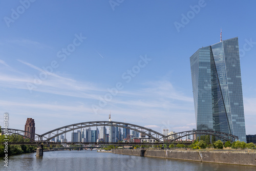 Deutschherrn bridge over the Main river in Frankfurt, Germany, during daytime with the city skyline in the background
