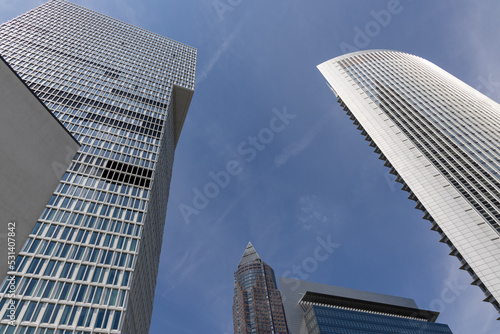 Low angle shot of the Pollux, One and Messeturm towers in Frankfurt, Germany photo