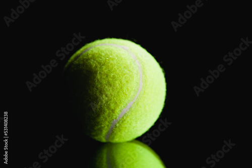 tennis ball on black background © S...