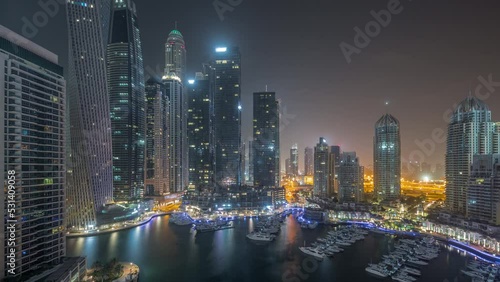 Wallpaper Mural Dubai marina tallest skyscrapers and yachts in harbor aerial all night timelapse. Torontodigital.ca