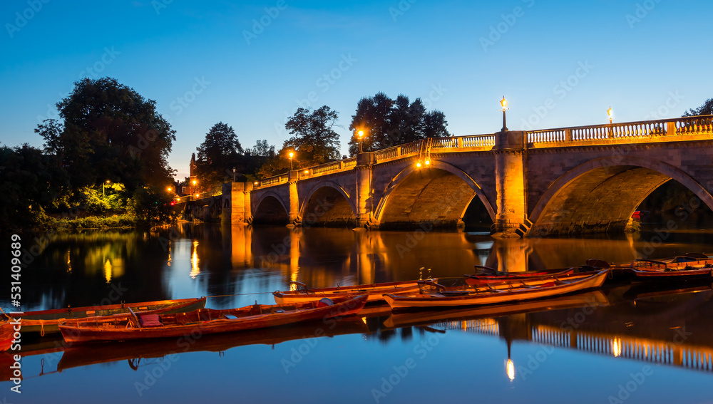 The famous landmark, iconic and historical bridge in London, Richmond Upon Thames, illuminated in evening lights, in United Kingdom