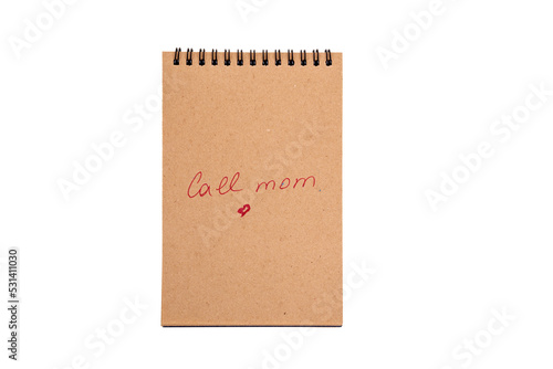 Positive statements. A phrase on a note sheet on a white background. Motivational concept with handwritten text. Craft notebook. phrase Call mom © Diana