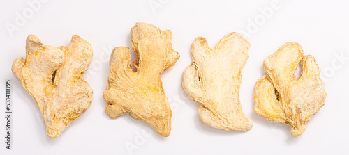 Dried ginger root on white background isolated. Indian spices close up.