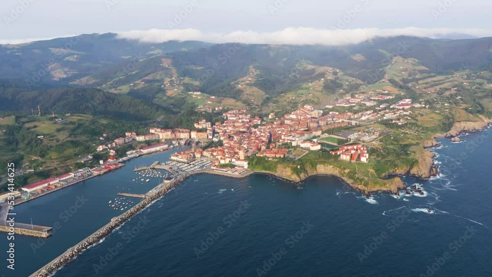 Bermeo - Spain perspective from above. Situated in north of Spain, in Basque Country is the most important fishing port of the region. Drone forward and descending. Beautiful panorama of the city. Bermeo - Spain perspective from above. Situated in north of Spain, in Basque Country is the most important fishing port of the region. Drone forward and descending. Beautiful panorama of the city.