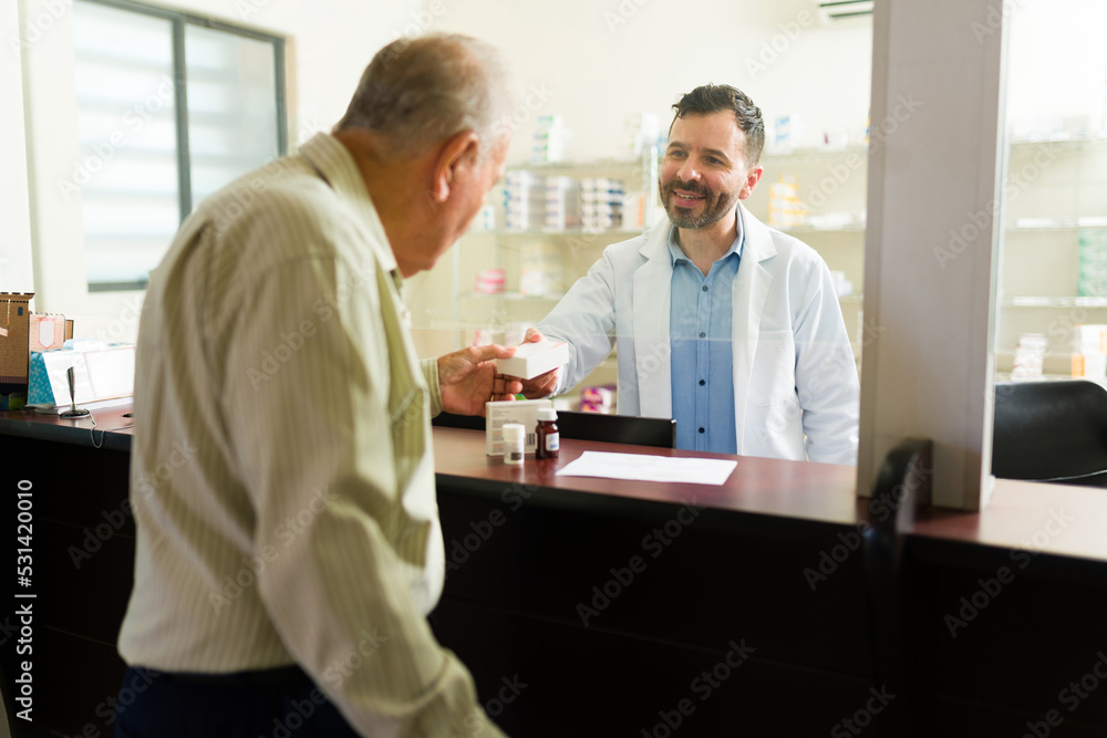 Elderly old man getting his prescription pills at the nursing home pharmacy Elderly old man getting his prescription pills at the nursing home pharmacy