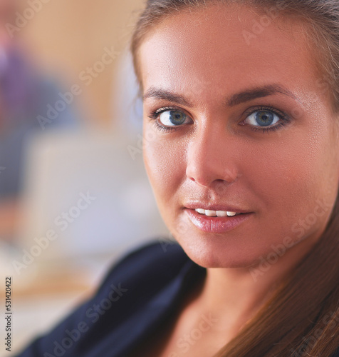 Free Download Young woman working in office, sitting at desk - GFXLoad