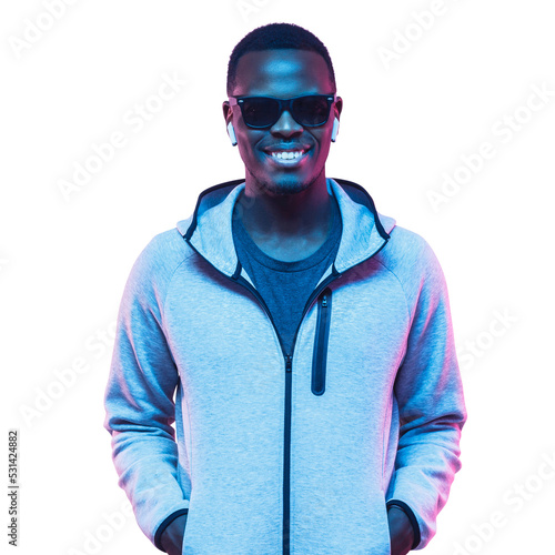 Young smiling handsome african man standing in gray hoodie and sunglasses