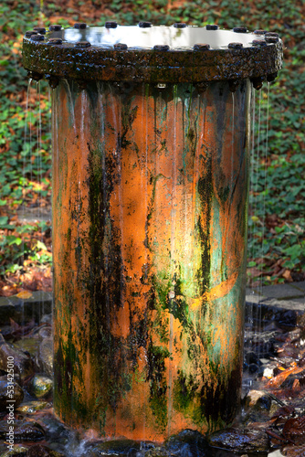Rusty old water pipe with corroded surface