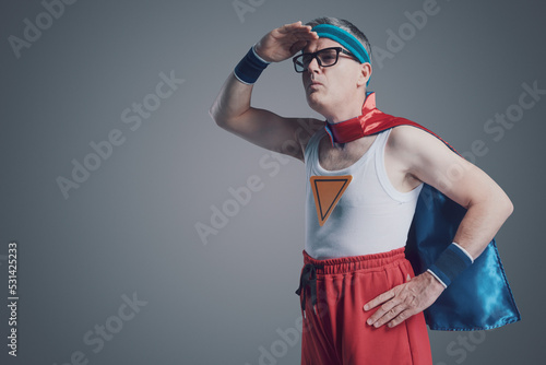 Funny nerd superhero looking away