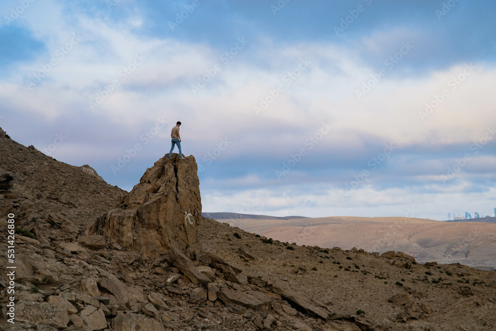 person standing on top of mountain