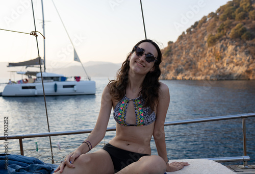 Beautiful young woman on sailing boat. Summer vacation, freedom, relaxing and holiday concept.  © burhan