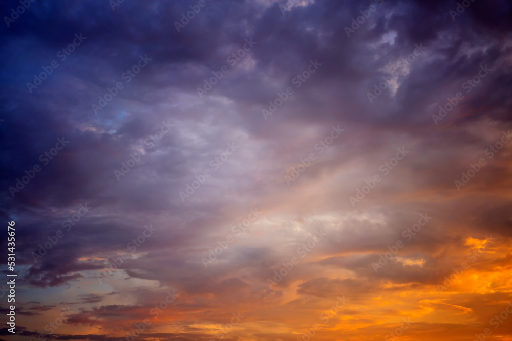 Beautiful bright multicolored sunset sky with yellow and pink hues, natural abstract background