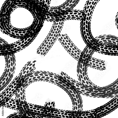 Round black traces of tire tracks, seamless pattern on white