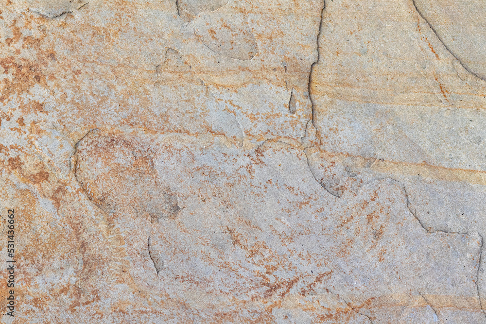 Texture of a stone wall with cracks and scratches which can be used as a backgr. The texture of the stone. Texture of a stone wall with cracks and scratches which can be used as a backgr. The texture of the stone.