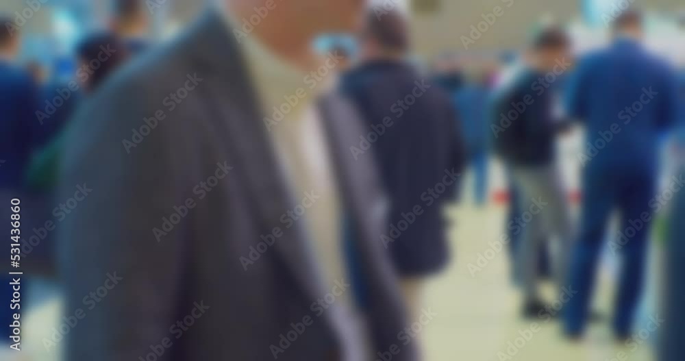 business life.blurred silhouettes of many unrecognizable people inside a modern building.modern urban environment.blurred background. business life.blurred silhouettes of many unrecognizable people inside a modern building.modern urban environment.blurred background.