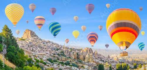 hot air balloons over Goreme town in Cappadocia region Turkey