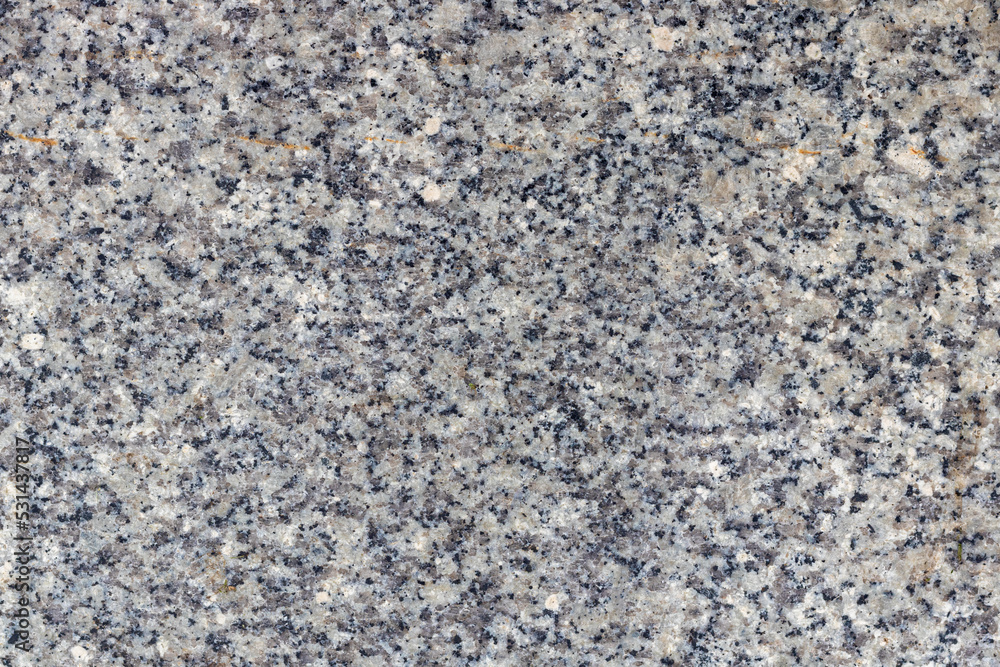 Texture of a stone wall with cracks and scratches which can be used as a backgr. The texture of the stone. Texture of a stone wall with cracks and scratches which can be used as a backgr. The texture of the stone.