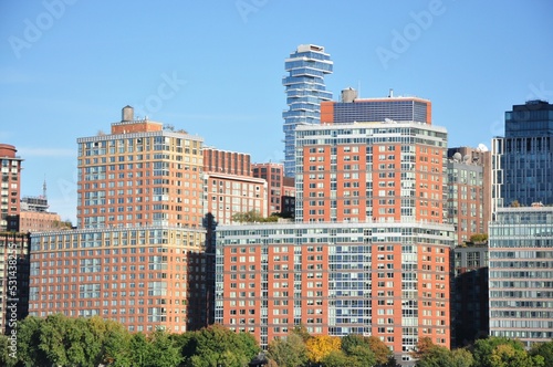 Slika na platnu Scenic view of 56 Leonard Street skyscraper behind classic houses in New York