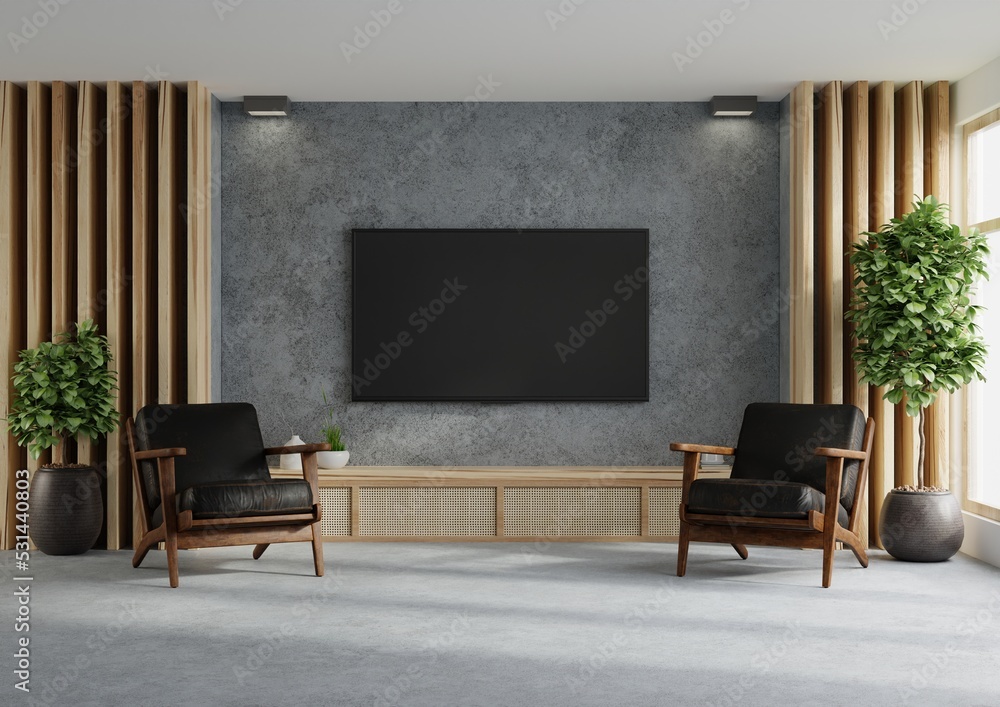 Concrete wall mounted tv on wooden cabinet with two leather armchair and decoration minimal. Concrete wall mounted tv on wooden cabinet with two leather armchair and decoration minimal.