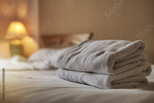 White towel on the bed decoration in bedroom interior ,White towel on the bed in the hotel room  © G_stockerthailand