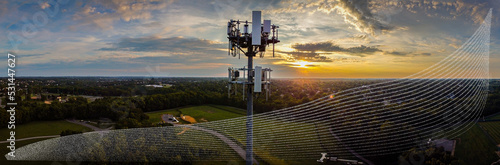 Representations of scattered radio waves coming out of 5G cell phone repeater tower during sunrise photo