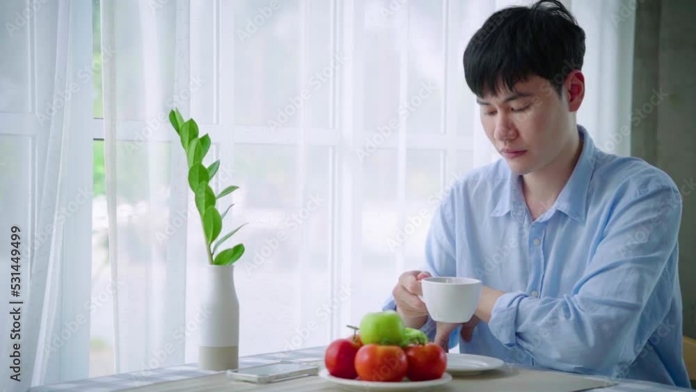 Young LGBTQ handsome asian man take cup coffee and take sipping, drinking morning coffee or tea at home. Men in cafe or restaurant drink americano or filter coffee with impress.
Young LGBTQ handsome asian man take cup coffee and take sipping, drinking morning coffee or tea at home. Men in cafe or restaurant drink americano or filter coffee with impress.