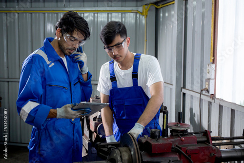 Supervisor training with young man sanding or iron at industrial factory, mechanic working job while polish metal, male having skill built steel with tool, labor and steelworks, industry concept.