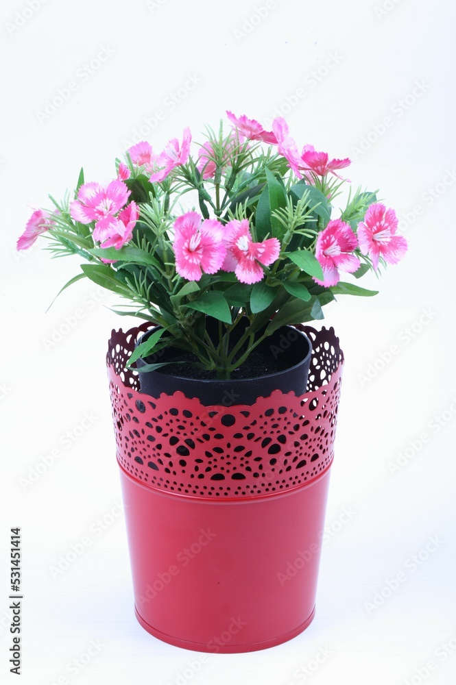 The artificial flower in the pot on white background The artificial flower in the pot on white background