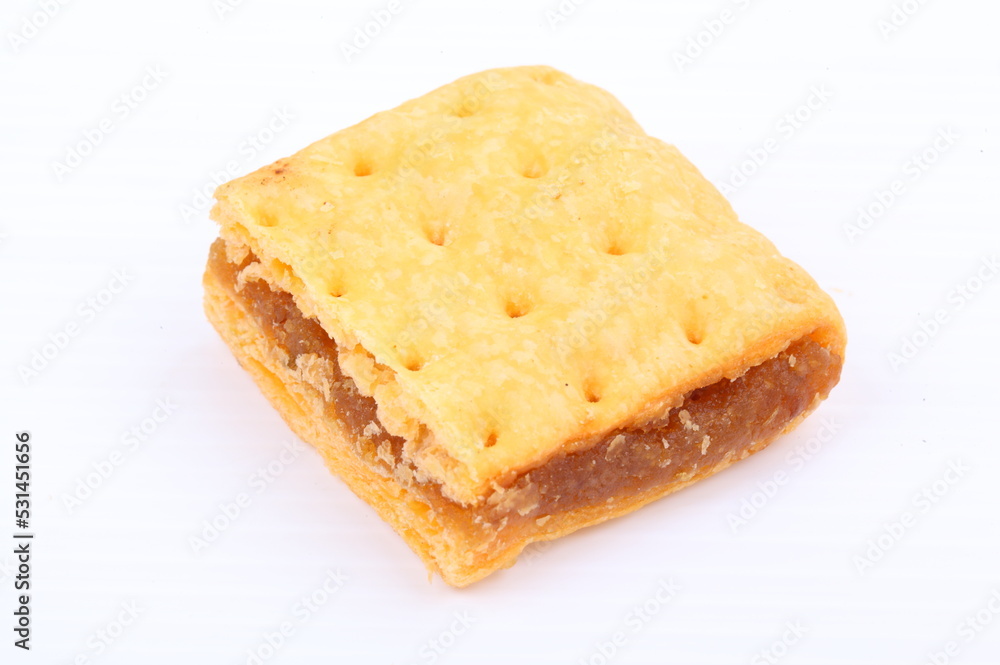 Butter cracker with pineapple jam isolated on the white background