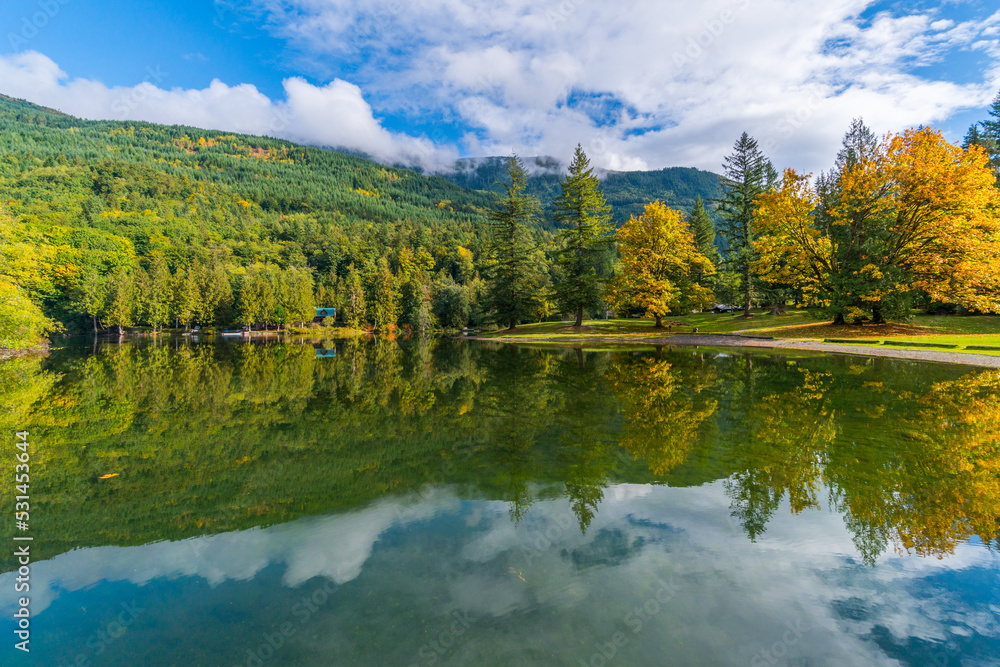 Autumn forest on the riverside, marvel at amazing views of the Silver Lake. Silver Lake Campground, Fall Time, North Cascades Region Autumn forest on the riverside, marvel at amazing views of the Silver Lake. Silver Lake Campground, Fall Time, North Cascades Region