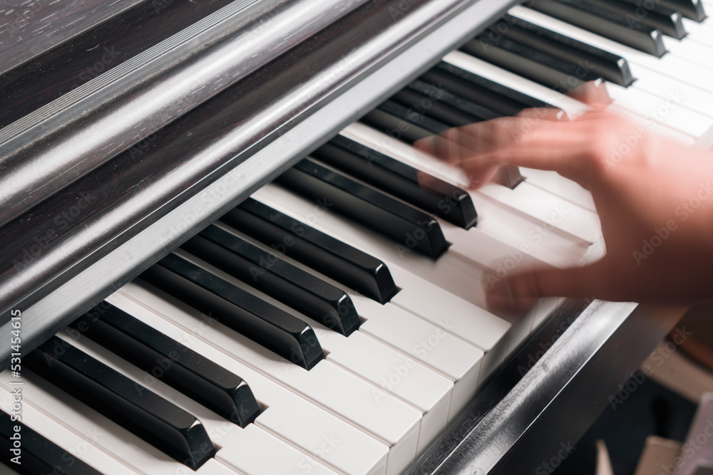 Close-up Of blurry hand fast Playing Piano Close-up Of blurry hand fast Playing Piano