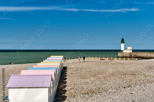 the bathing cabins on the pebble beach, lighthouse and pier at Le Tréport, Seine-Maritime department in Normandy, France. photo